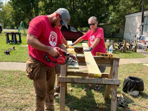 Man and woman building a ramp